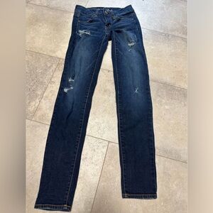 American Eagle “super stretch” distressed jeggings size 00